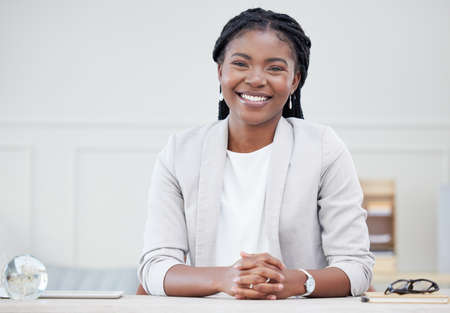 She is a strong young woman. Shot of a beautiful young businesswoman taking a break in her office.