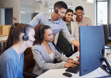 The whole team are on it especially for you. Shot of a group of call centre agents working together...