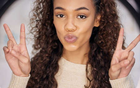 All about that peace baby. Portrait of a beautiful young woman showing the peace symbol while...