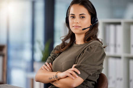 Keeping your cool is part of the job. Portrait of a young female call center agent on a call with a...