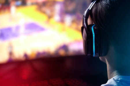 Deep in a digital world. Rearview shot of a young man playing computer games.