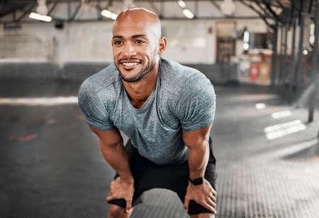 Go until you cant anymore. a young man taking a break during a workout to catch his breath.