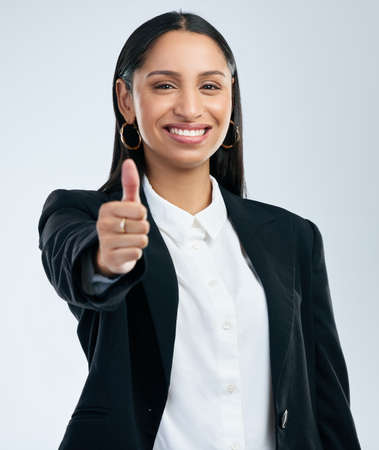 You can only become truly accomplished at something you love. a young woman showing thumbs up...