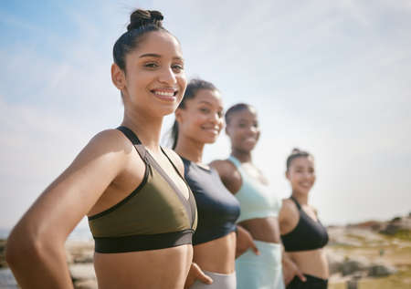 Working hard for the body I want. a group of friends looking strong during a workout session.の写真素材