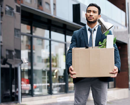 Failure isnt fatal, but failure to change might be. a young businessman looking depressed after...