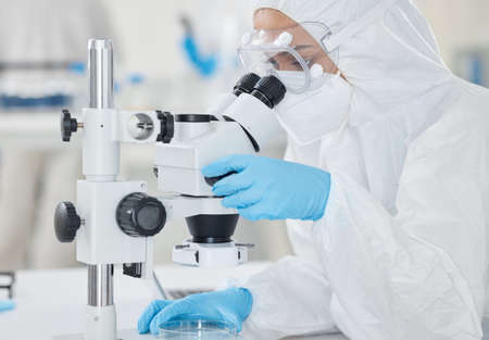 Supporting scientific investigations with detailed analysis. a scientist wearing a radiation suit...