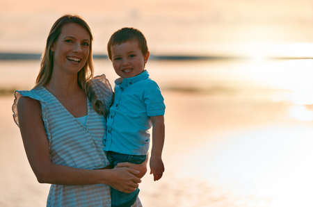 Well have these memories forever. a young mother spending time with her son at the beach.の写真素材
