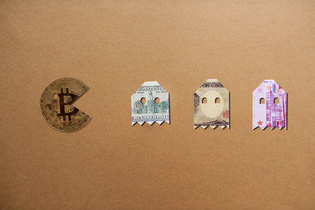 Money makes all the difference. Studio shot of bitcoin pacman chasing the money alines against a...