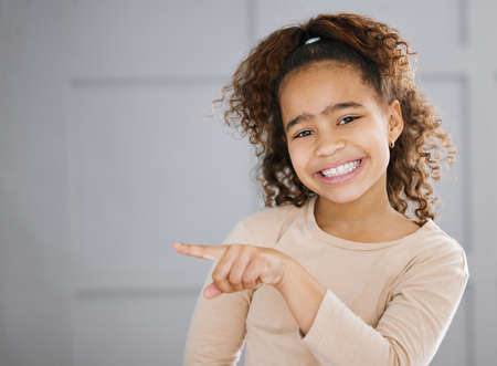 Its my number one recommendation. Cropped portrait of an adorable little girl pointing towards the...