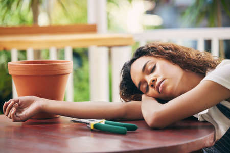 The heat finally got to me. a tired nursery owner taking a break from work to nap.