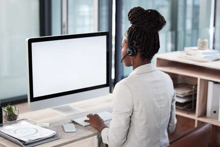 Shell help you navigate your way to a solution. Rearview shot of a young call centre agent working...