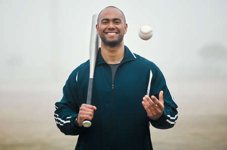 Up for a game. Cropped portrait of a handsome young male baseball player standing outside.