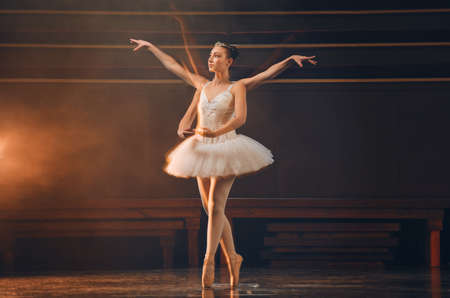 Dance for yourself. a young woman practicing her routine in a stage.の写真素材