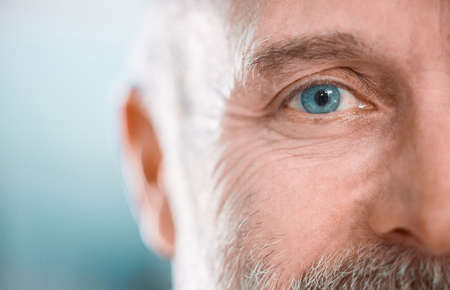 Thinking is the hardest work there is. an unrecognisable man looking into the camera during a day in...
