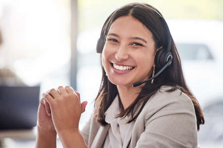 Im glad I could help. Cropped portrait of an attractive young female call center agent working in...
