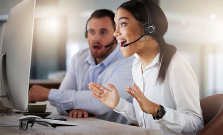 Did I really make saleswoman of the month. a young call centre agent looking surprised while working...