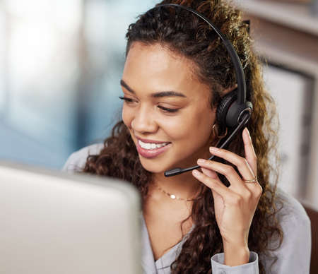 Today is a good day to make someones day. a young businesswoman working in a call center.