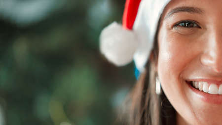 Can you tell how happy I am. a young woman celebrating Christmas at home.の写真素材