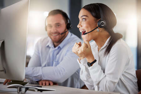 Is this for real. a young call centre agent looking surprised while working on a computer in an...