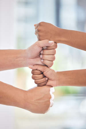 Unity breeds professional harmony. a group of business people with their hands stacked.の写真素材