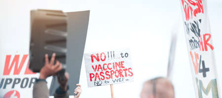 We will not be forced. Cape Town, South African - October 2, 2021 Unrecognisable demonstrators holding up signs and protesting against the Covid 19 vaccine.の写真素材