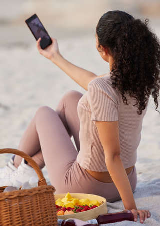 Capturing some of my favourite moments on the beach. an unrecognisable woman sitting alone on the...