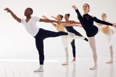 I dreamed of being a ballerina. a group of ballet dancers practicing a routine in a dance studio.