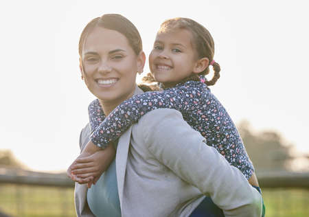 My little girl, the love of my life. an adorable little girl enjoying a piggyback ride with her...