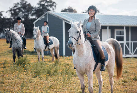 Horse riding is a great way to see the sights. Cropped portrait of an attractive young woman horse...