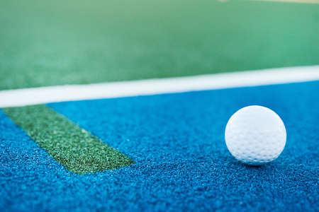 Dont just set goals, score them. Closeup shot of a hockey ball on a pitch.の写真素材
