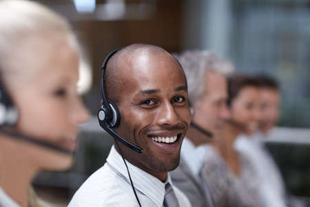 Service with a friendly smile. Portrait of a handsome african american customer service...