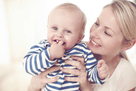 Hes my perfect angel. Cropped view of a cute baby boy being held by his mother.
