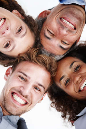 High energy business team. Low angle portrait of a group of positive-looking businesspeople standing...