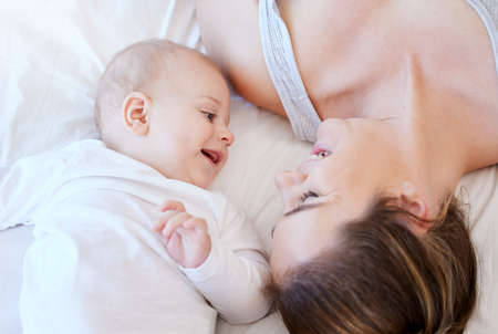 Moment that I cant miss. a young mother bonding with her adorable baby boy at home.