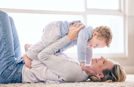 Spending time with my little one brings me so much joy. a woman bonding with her baby boy at home.