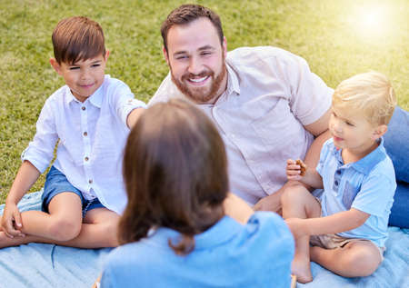 Its bonding time. a young family spending a day at the park.の写真素材