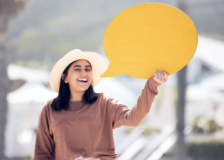 Shout it out and scream. a young woman holding a speech bubble.の写真素材