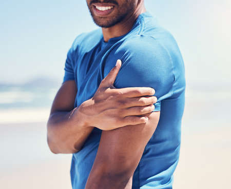 Body aches remind you of the importance of stretching. a man experiencing discomfort in his arm...