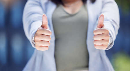 Keep at it and you will succeed. Closeup shot of an unrecognisable businesswoman showing thumbs up...