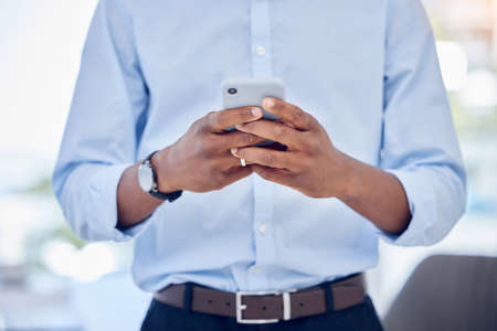 Ive got new connections to make. an unrecognizable businessperson using a phone at work.