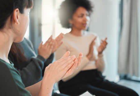 What we achieve inwardly will change outer reality. people clapping hands during a group therapy session.の写真素材
