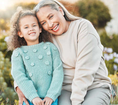 Family is your heart. a grandmother and grandchild spending time together in the garden at home.