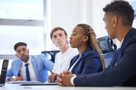 She makes a valid point. a young businesswoman having a meeting with her colleagues in an office.