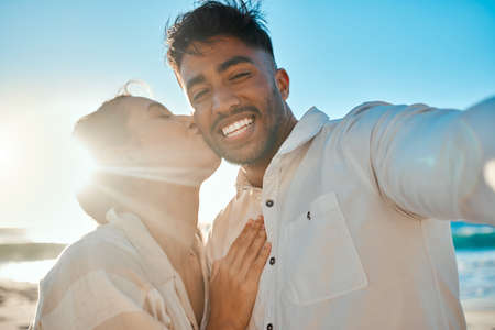 I want to spend all my summer days with you. a young couple spending time together at the beach.の写真素材