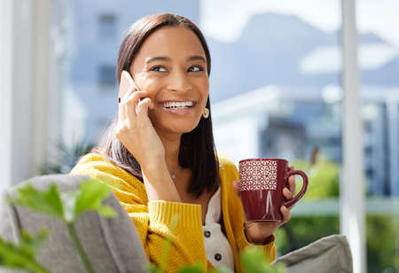 I get happier with every phone call. a young woman on a call at home.