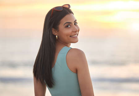 Picture perfect. a beautiful young woman enjoying some time at the beach.