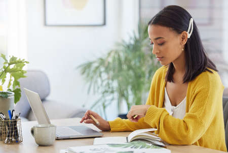 Being a business owner takes sacrifice. a young businesswoman working in a modern office at work.