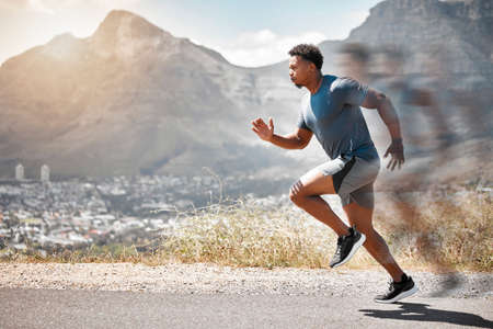 Set goalposts while you run. a handsome young man running alone outdoors.