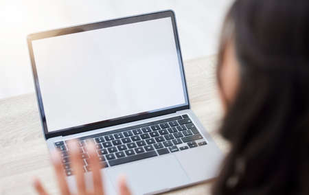 Connect and get ahead. Closeup shot of an unrecognisable businesswoman having a video call on a...