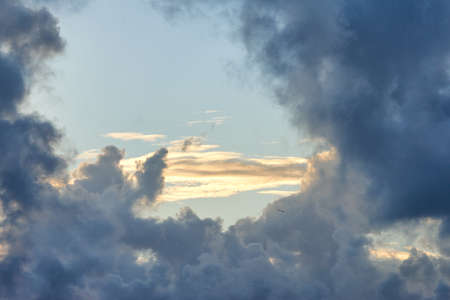 Copy space with dark clouds on a sunny day with a bright blue sky. Quiet landscape and peaceful...